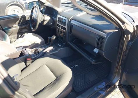 2004 Jeep Grand Cherokee Laredo z USA, uszkodzony, nr VIN 1J4GW48S74C385078